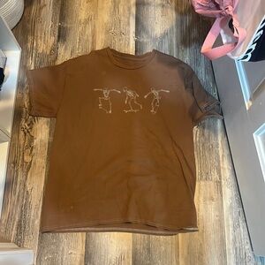 Cute graphic tee from Tilly’s! Size medium, skateboarding skeletons on front